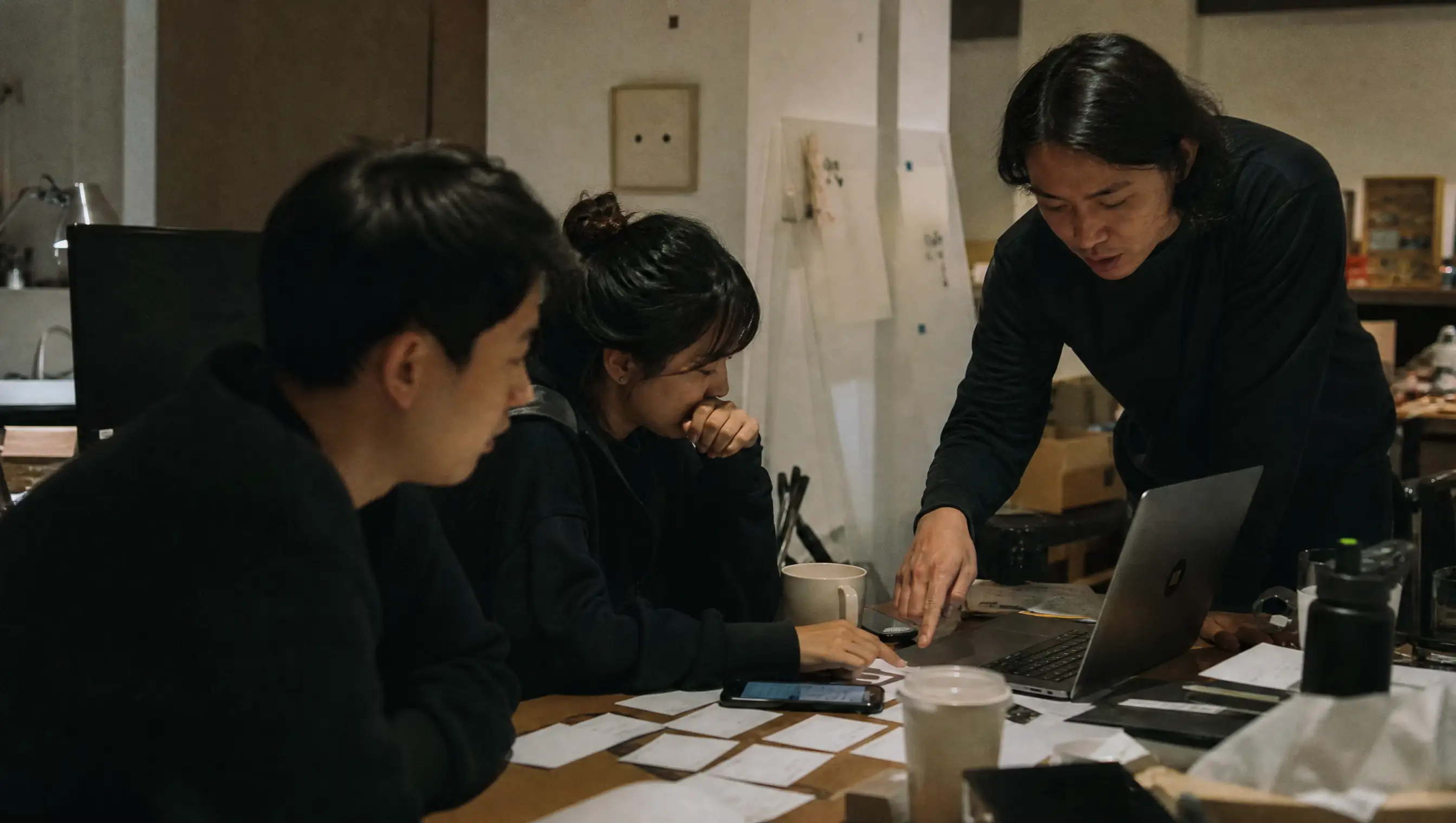 Product team mapping a customer journey around a shared table